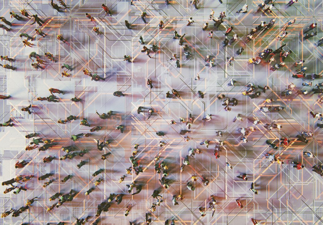 Abstract crowds of people with virtual reality street display symbolizing people going in different directions and the significance of OKRs